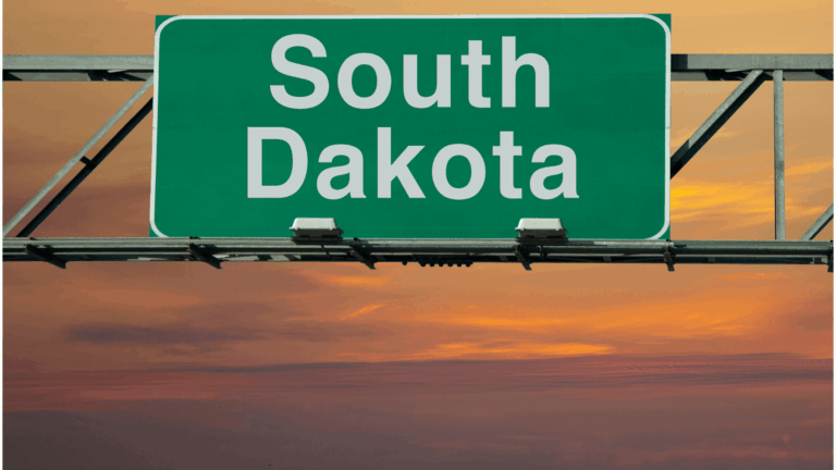 Can you register your vehicle in South Dakota and live in Mexico?